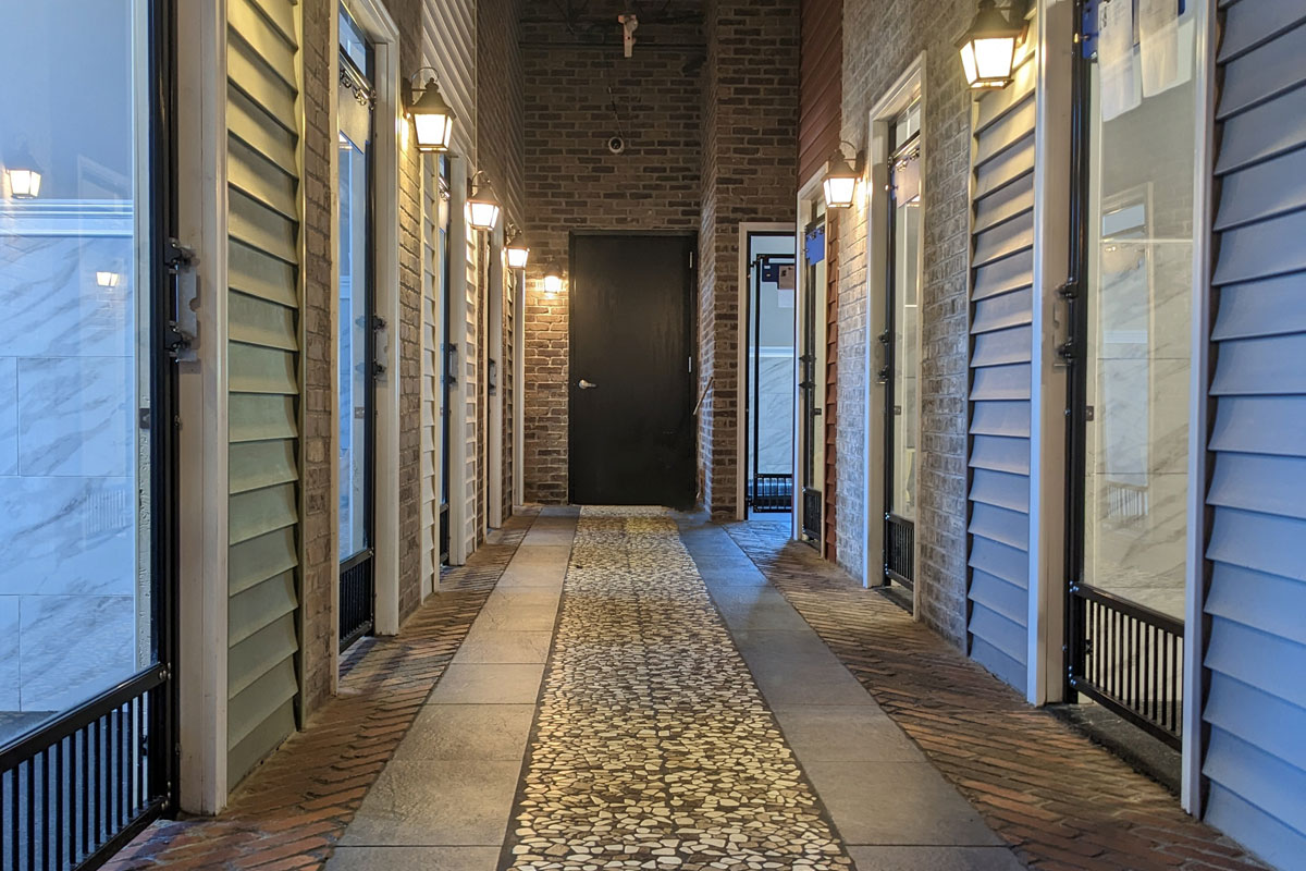 Photo of the Elfreth's Alley hallway with doors to the boarding rooms