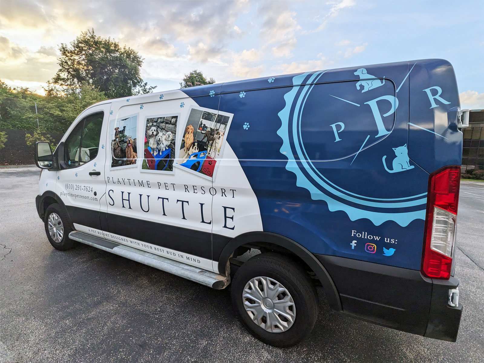 Angled image of one side of the Playtime Pet Resort shuttle van